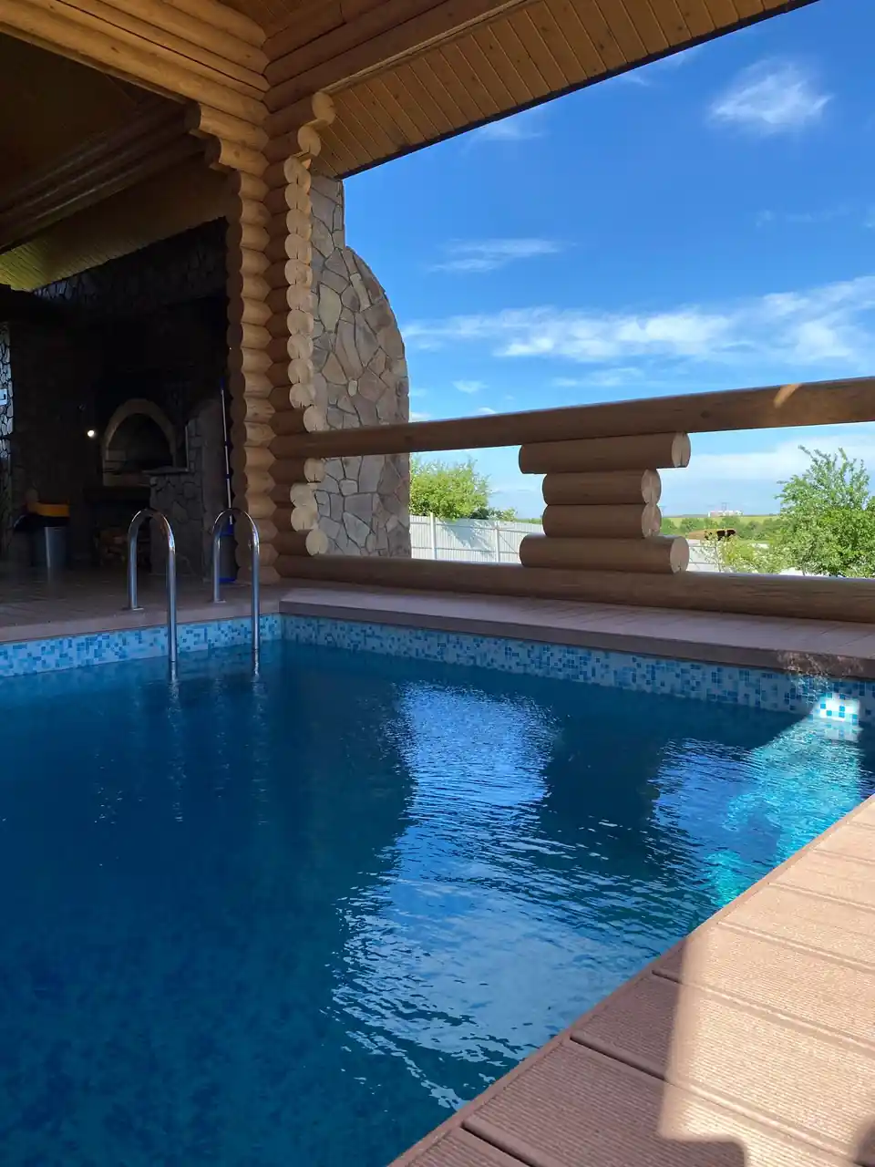 Serene indoor bath architectural pool reflecting pale daylight through clean arches