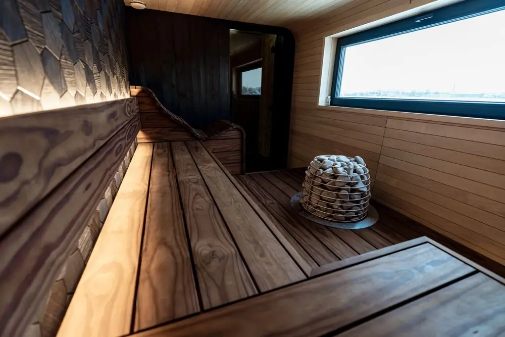 Minimalist Nordic style timber sauna with clean lines and soft ambient lighting